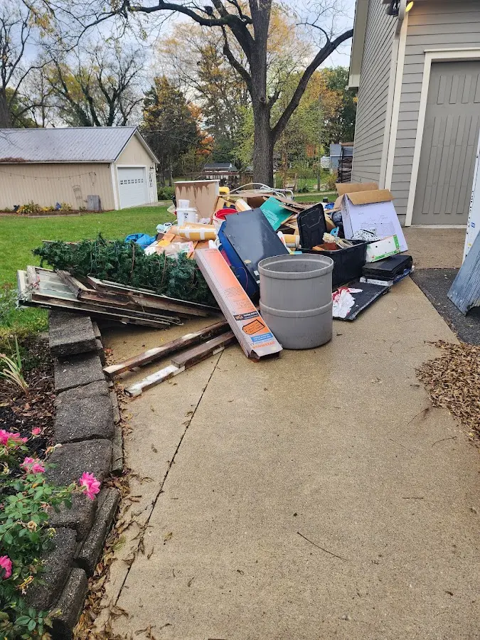 Dumpster being loaded with debris for Residential Dumpster Rental in Colby